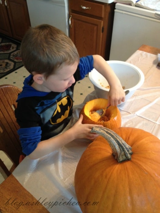 Pumpkin Carving with Kids - David cleaning his pumpkin