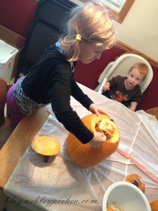 Pumpkin Carving with Kids - Jenny gutting the pumpkin