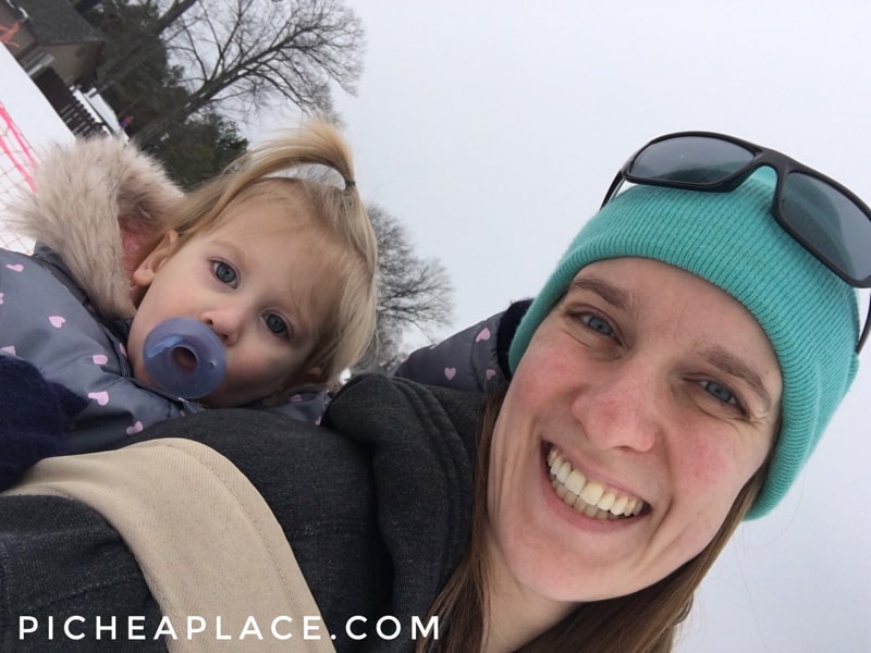 Toddler-wearing on the ski hill at Caberfae Peaks.