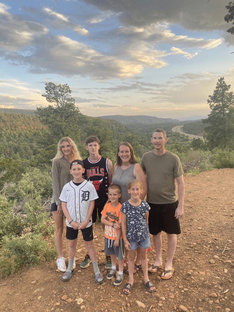 family photo on the mountain top at Glorieta Adventure Camp in New Mexico